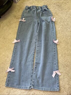 Light Blue Jeans with Pink Bow Accents